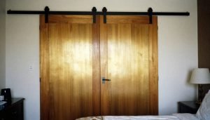 luxury sliding door kit in brushed gold finish on custom wood barn door