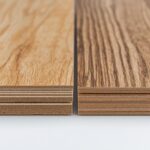 A side-by-side close-up comparison of vinyl plank flooring and laminate flooring, showing cross-section layers and surface texture differences.