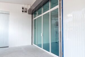 Close-up of bifold glass door hardware showing quality aluminium frame, slim sightlines and smooth folding mechanism