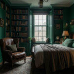 Dark academia bedroom with deep green walls, leather wingback chair, and floor-to-ceiling bookshelves