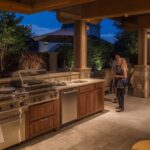 Evening entertaining scene with illuminated outdoor kitchen