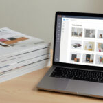 Stack of design magazines and a laptop open to a mood board app