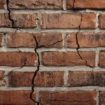 Visible cracks in exterior brick wall