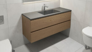 A modern floating vanity with a matte oak finish and integrated sink, mounted above light gray floor tiles in a compact bathroom.
