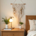 Boho macrame textile wall hanging above a nightstand
