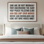 Large statement art print framed above a bedroom bed