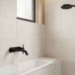 Matte black faucet and showerhead in a modern bathroom