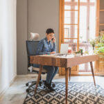 Modern home office with ergonomic furniture and natural lighting
