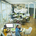 Modern open office with meeting rooms and collaborative workspace
