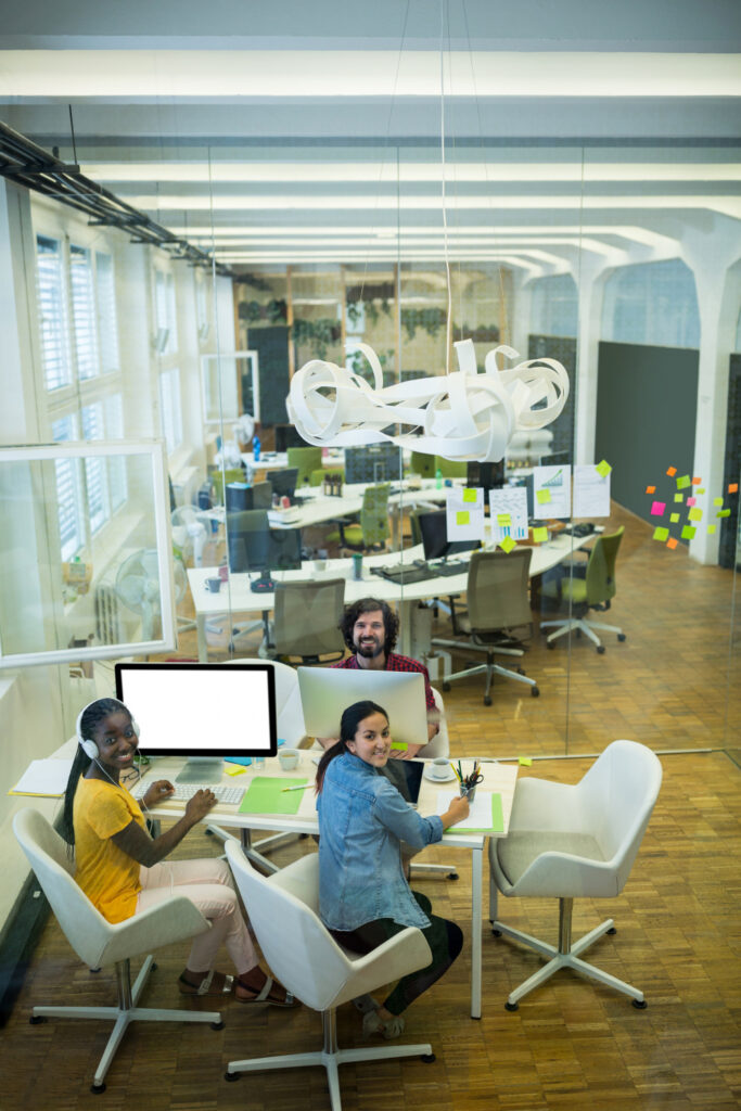 Modern open office with meeting rooms and collaborative workspace
